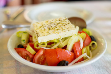 Greek salad on the table in the Greek restaurant