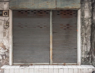 Old building with a rusty roller shutter door