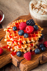 Belgian waffles with fresh berries and coffee