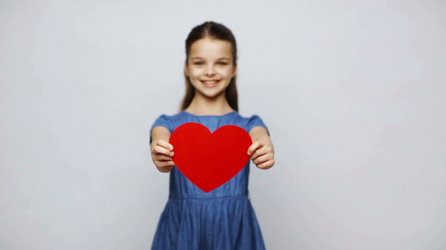 happy smiling girl with red heart