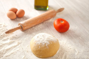 Ingredients and utensils to cook pizza