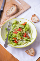 salad with lettuce leaves, cucumber and tomatoes