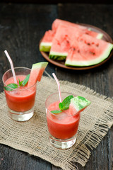 Watermelon drink in glasses with slices of watermelon