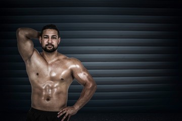 Fototapeta na wymiar Composite image of muscular man flexing for camera