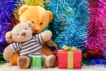 decorate Christmas and little bear on the wood floor