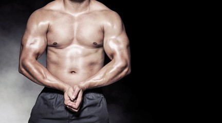 Composite image of portrait of a bodybuilder man flexing muscles