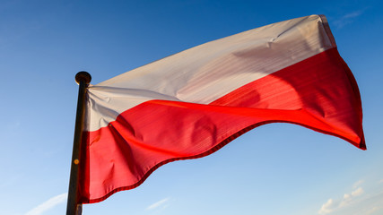 Polish flag - against blue sky
