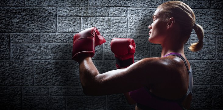 Composite image of side view of female boxer