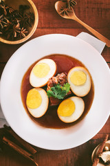 Eggs and pork in brown sauce,Thai Cuisine,shallow Depth of Field,Focus on pork. 