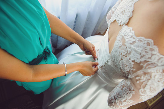 Bridesmaid Tying Dress