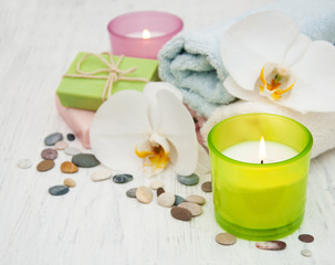 Fototapeta na wymiar Orchids, candle, towel and handmade soap