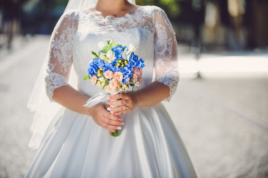 Bride with Bouquet in Street