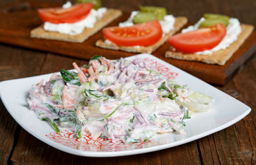 salad with vegetables and cheese tartlets