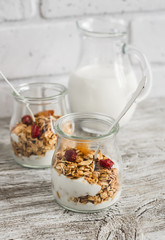 Homemade granola and natural yoghurt on a light wooden surface. Healthy food, healthy Breakfast or snack