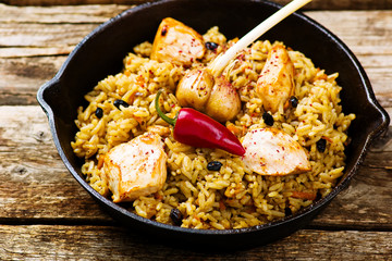 pilaf in a pig-iron frying pan