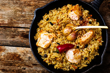 pilaf in a pig-iron frying pan