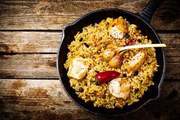 pilaf in a pig-iron frying pan