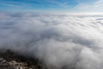 über den Wolken - Aerial view of the sky and fog a from a plateau on a mountain.