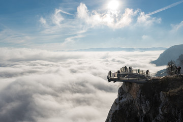 View of an Skywalk high above a smokescreen in front of blue sky in Lower Austria
