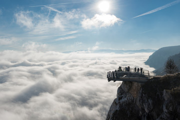 View of an Skywalk high above a smokescreen in front of blue sky in Lower Austria