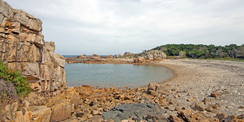 Rocks on a beach along a sea in summer