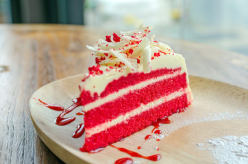 Red velvet cake on wood plate