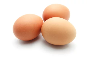  Three eggs isolated on white background © petzshadow