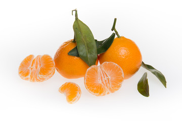 Tangerines with leaves isolated on white background