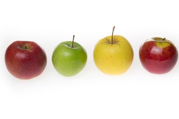 Various fresh ripe apples in different colors.