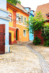 Medieval street view in Sighisoara founded by saxon colonists in