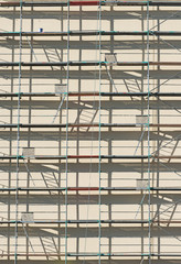 Scaffolding in front of house. Facade renovation.