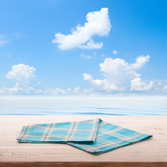 Empty table and tablecloth. Nature background outdoors.