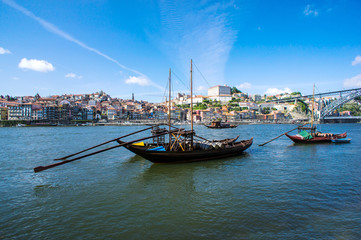 Port wine storage warehouses and transport boats at river Duoro, Porto, Portugal