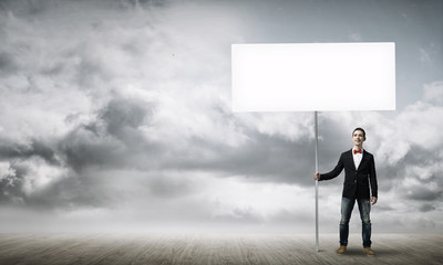 Guy with white billboard