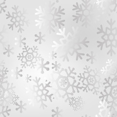 Christmas light seamless pattern of big and small snowflakes.