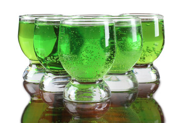 Glass cup with tequila on white background