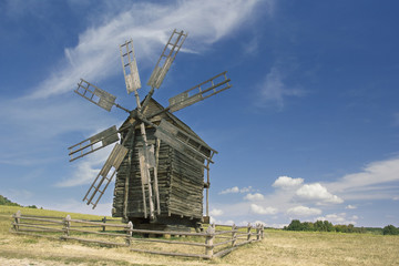 Fototapeta premium old wooden windmill in a field