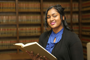 Portrait attractive female lawyer in law library