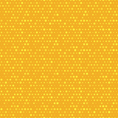 Orange and yellow dotted vector seamless pattern.