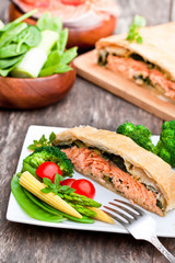 Salmon  fillet on leek and spinach  baked in puff pastry with ve