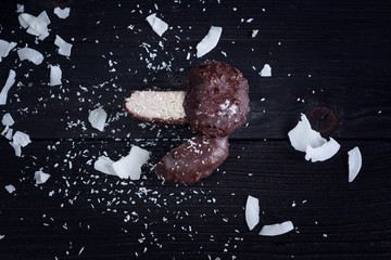 Coconut raw cake
Coconut dessert with chocolate on a black wooden table.