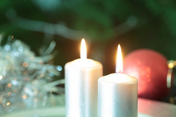 Obraz na płótnie Canvas candle with Christmas ornaments 