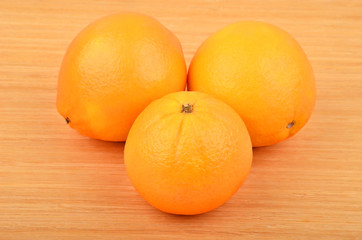 Orange on wooden background