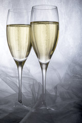 Two Glasses of Champagne on Grey Background