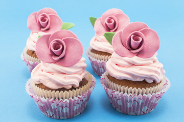Vintage cupcakes on a blue background