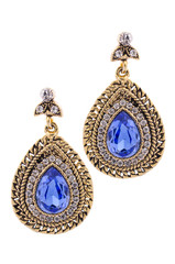 Gold earrings inlaid with  gemstones on a white background