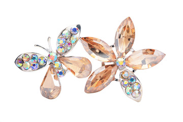 brooch with a flower and a butterfly isolated on white