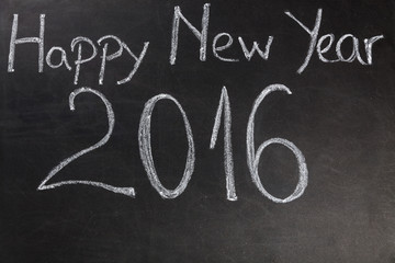 Obraz premium Happy New Year 2016 written with chalk on blackboard
