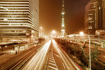 Fototapeta premium light trails on the modern building background in shanghai china