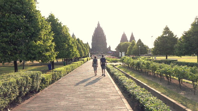 People sightseeing Prambanan temple in Indonesia, slow motion